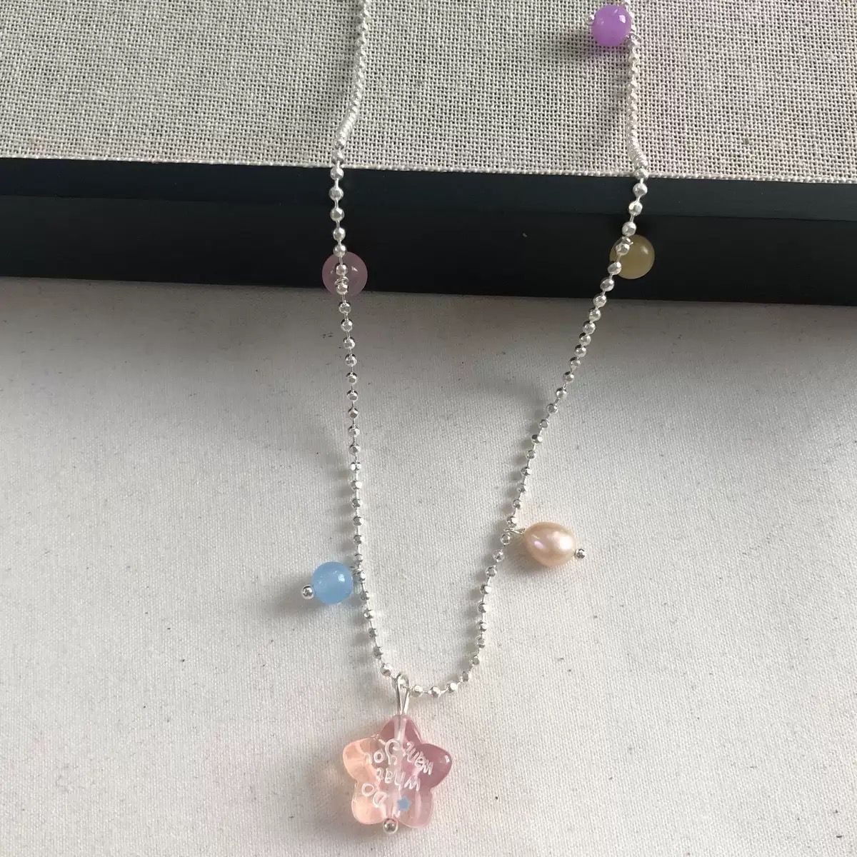 Pink star design necklace