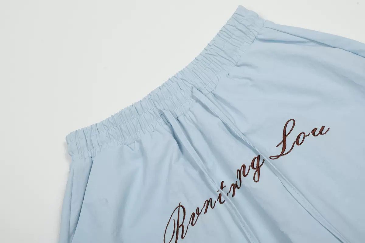 Embroidered shell print pants