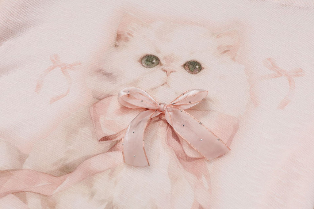 Pastel pink top with ribbon